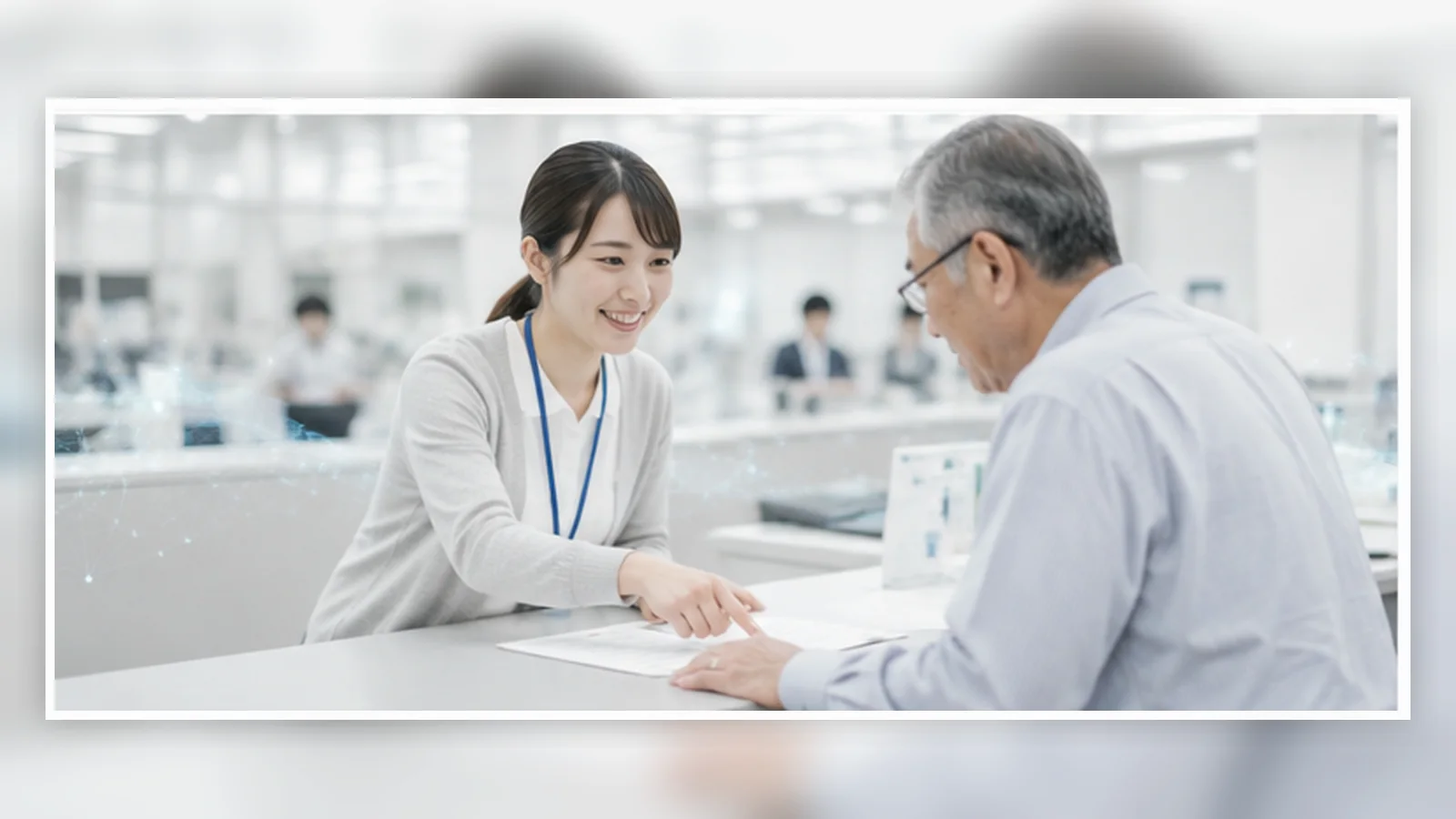 自治体・公共施設の窓口で利用者に対応する職員のイメージ